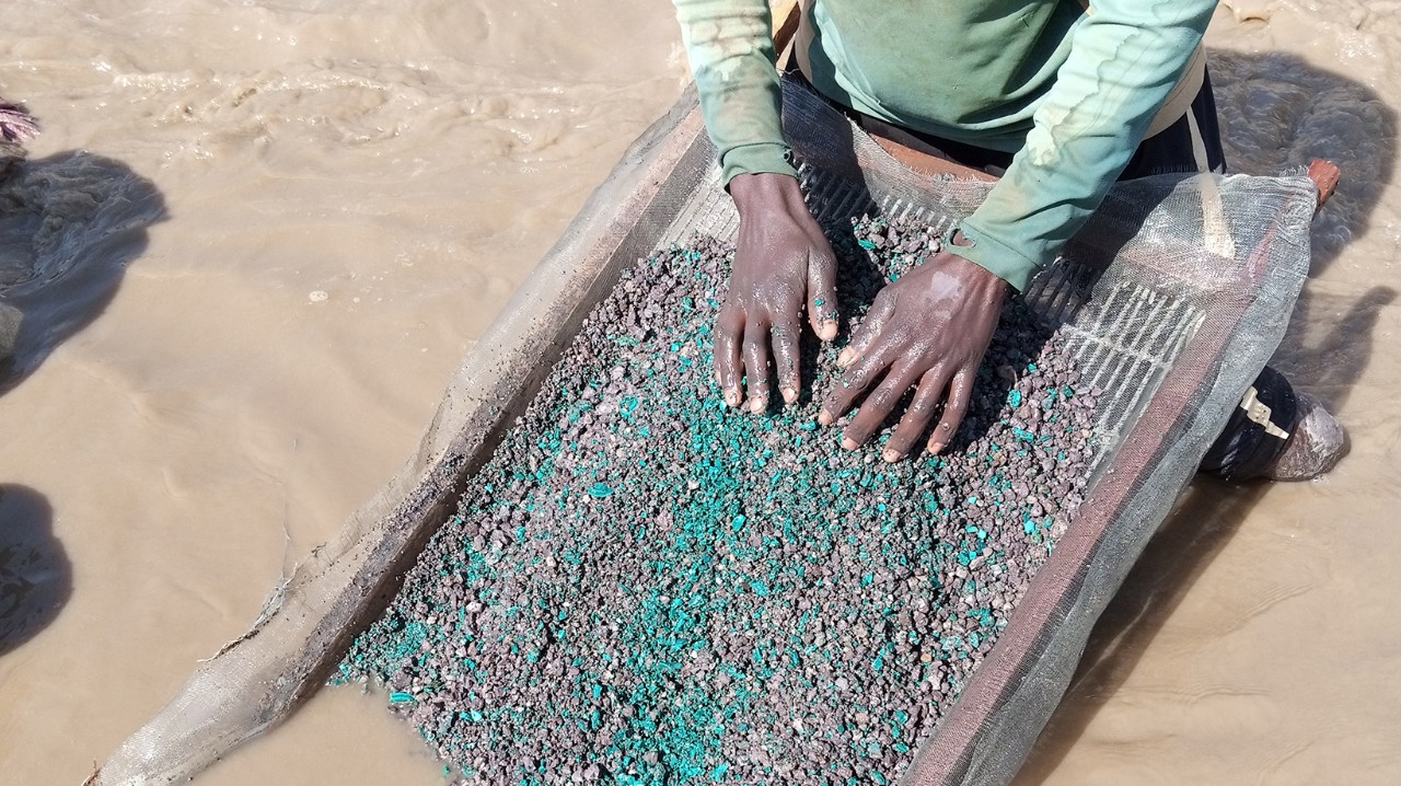 Artisanal miner washing cobalt 