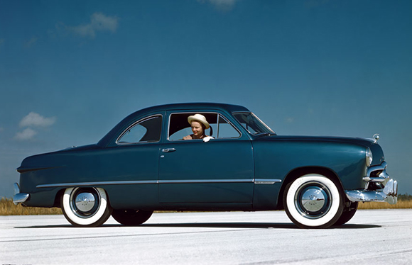 Woman in 1949 blue vehicle